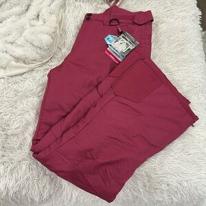 Arctic Quest woman’s ski pant in size Medium in the color raspberry.
